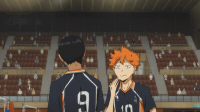 A Man With The Number 9 On His Back Stands Next To Another Man GIF