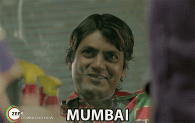 A Man With The Word Mumbai Written On His Chest GIF
