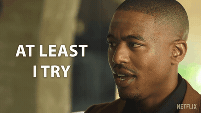 A Man With The Words At Least I Try On The Bottom GIF