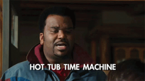 A Man With The Words Hot Tub Time Machine Written On His Chest GIF