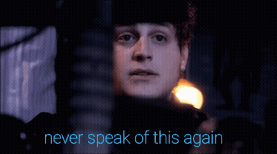A Man With The Words Never Speak Of This Again Written Below Him GIF