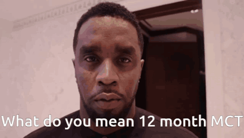 A Man With The Words What Do You Mean 12 Month Mct On The Bottom GIF