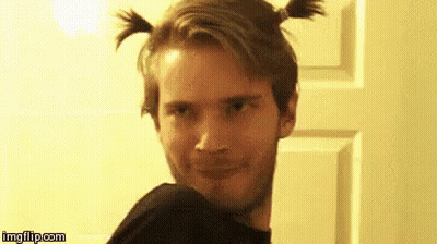 A Man With Two Pigtails In His Hair Is Making A Funny Face . GIF