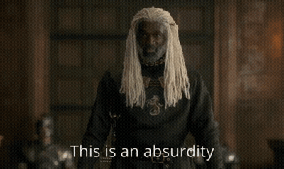 A Man With White Dreadlocks Is Standing In Front Of A Sign That Says " This Is An Absurdity " GIF