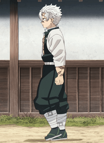A Man With White Hair And Green Pants Is Standing In Front Of A Wooden Wall GIF