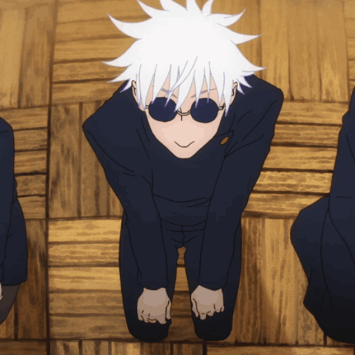 A Man With White Hair And Sunglasses Is Kneeling Down On The Floor GIF