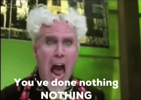 A Man With White Hair Is Screaming With The Words `` You 'Ve Done Nothing Nothing '' Behind Him . GIF