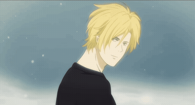 A Man With Yellow Hair And A Black Shirt GIF
