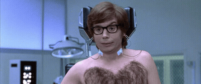 A Man Without A Shirt Has Headphones On His Head GIF