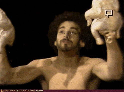 A Man Without A Shirt Is Holding A Chicken In His Hands With A Picture Is Unrelated.com Link Below GIF