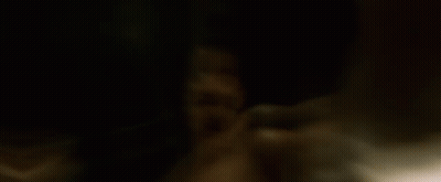A Man Without A Shirt Is Holding A Knife In His Hand GIF