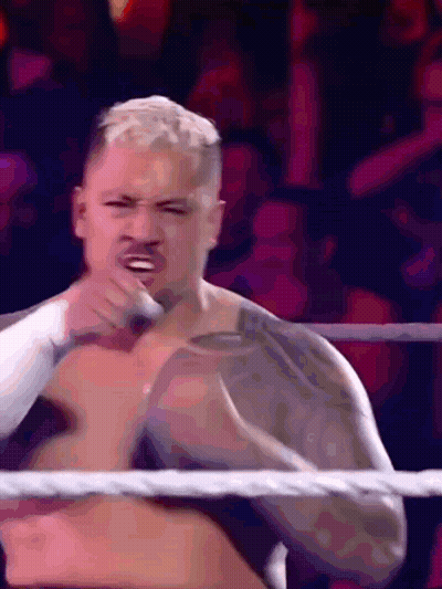 A Man Without A Shirt Is In A Wrestling Ring Making A Face GIF