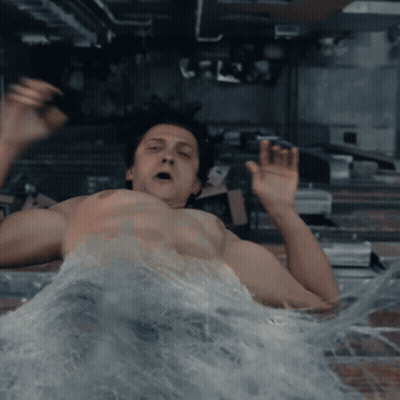 A Man Without A Shirt Is Laying In A Pool Of Water GIF