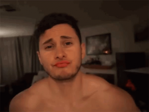 A Man Without A Shirt Is Making A Funny Face GIF