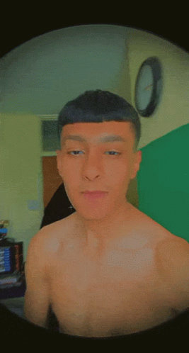 A Man Without A Shirt Is Making A Funny Face With His Eyes Closed GIF