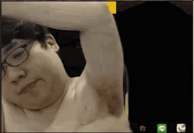 A Man Without A Shirt Is On A Video Call With A Green Line Icon In The Corner GIF