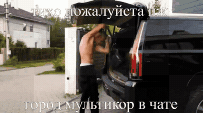 A Man Without A Shirt Is Opening The Back Of A Black Suv GIF