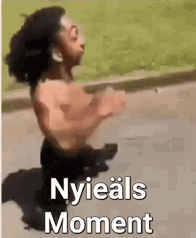 A Man Without A Shirt Is Running Down The Street With The Words Nyieals Moment Written On The Bottom . GIF