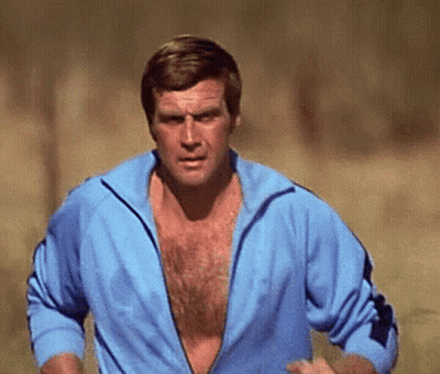 A Man Without A Shirt Is Running In A Field GIF