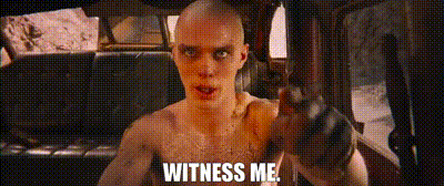 A Man Without A Shirt Is Sitting In A Car Holding A Gun And Saying `` Witness Me '' . GIF