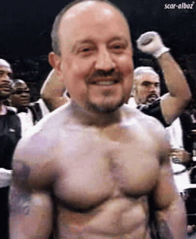 A Man Without A Shirt Is Smiling With Scar-Alboz Written In The Corner GIF