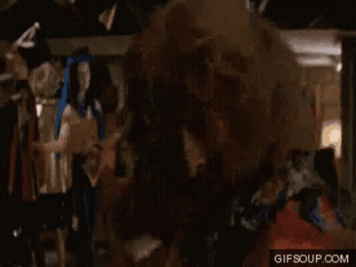 A Man Without A Shirt Is Standing In A Room With A Gif Soup.com Watermark GIF