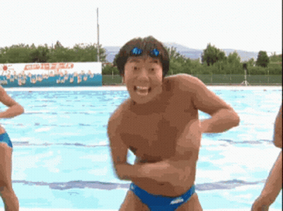 A Man Without A Shirt Is Standing In A Swimming Pool GIF