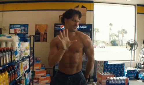 A Man Without A Shirt Is Standing In Front Of A Pepsi Cooler GIF
