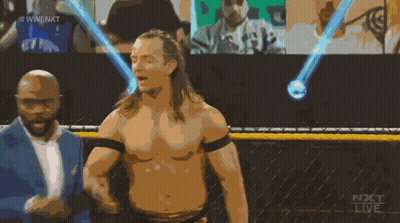 A Man Without A Shirt Is Standing In Front Of A Screen That Says Next Live GIF