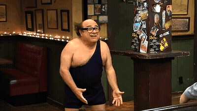 A Man Without A Shirt Is Standing In Front Of A Sign That Says ' Ad Here ' GIF