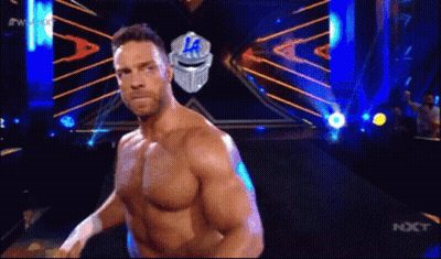A Man Without A Shirt Is Standing In Front Of A Sign That Says ' La ' On It . GIF