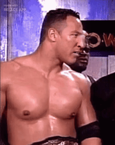 A Man Without A Shirt Is Standing In Front Of A Sign That Says ' Reface App ' On It GIF