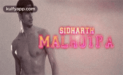 A Man Without A Shirt Is Standing In Front Of A Sign That Says Siddharth Malhotra GIF