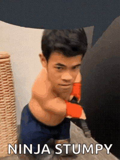 A Man Without A Shirt Is Standing Next To A Wicker Basket And Says Ninja Stumpy . GIF