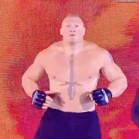 A Man Without A Shirt Is Standing With His Hands On His Hips In Front Of A Colorful Background . GIF