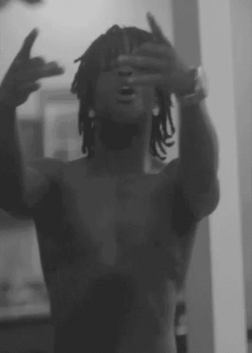 A Man Without A Shirt Is Taking A Picture Of Himself GIF