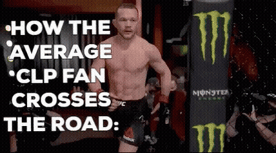 A Man Without A Shirt Is Walking In Front Of A Monster Energy Bag . GIF