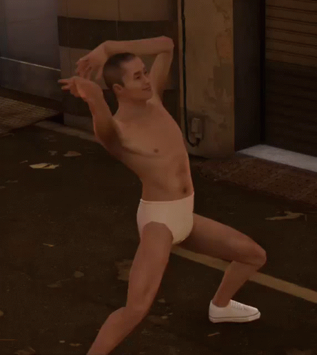 A Man Without A Shirt Is Wearing White Underwear And White Shoes GIF