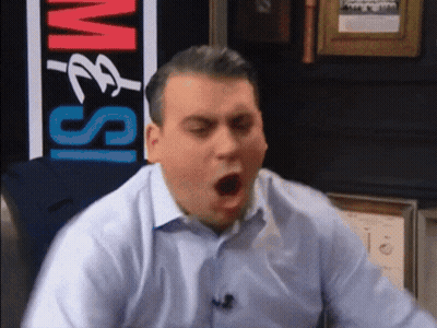 A Man Yawning In Front Of A Sign That Says ' M & S ' On It GIF