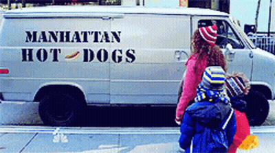 A Manhattan Hot Dog Van Is Parked On The Street GIF