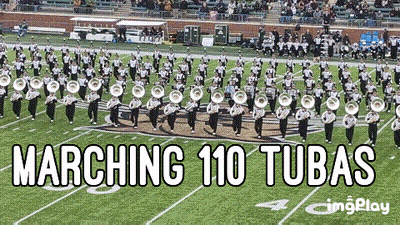 A Marching 110 Tubas Band Is Marching On A Field GIF