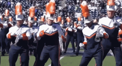 A Marching Band With The Letter B On Their Hats Is Performing On A Field GIF