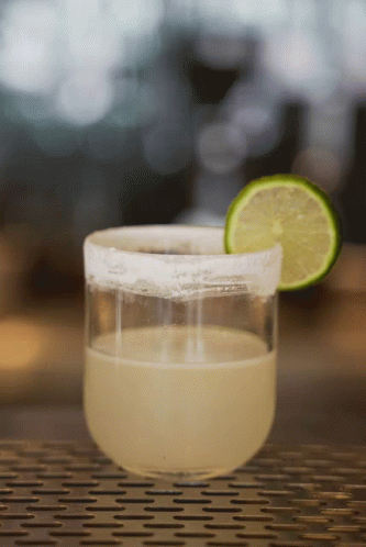 A Margarita In A Glass With A Slice Of Lime On The Rim GIF