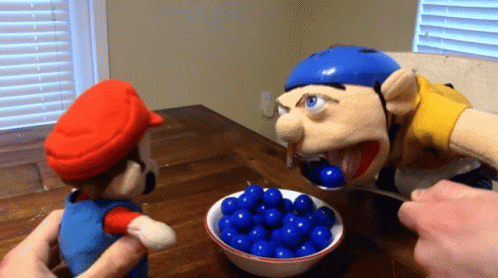 A Mario Puppet Is Being Fed Blue Balls By A Jeff Puppet GIF