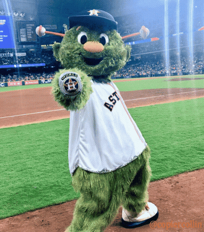 A Mascot For The Astros Is Holding A Ball GIF