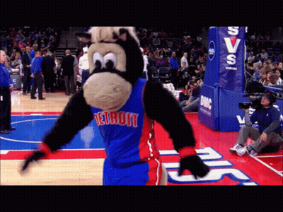 A Mascot For The Detroit Pistons Is Dancing On The Court GIF
