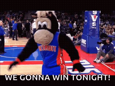 A Mascot For The Detroit Pistons Is Dancing On The Court GIF