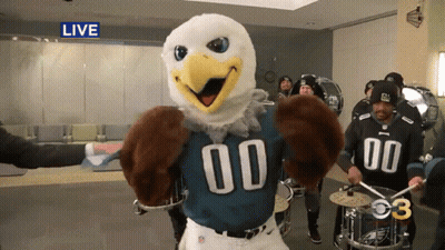A Mascot For The Eagles Is Playing Drums GIF