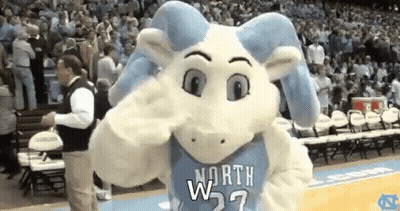 A Mascot For The North Carolina Rams Is Standing On A Basketball Court GIF