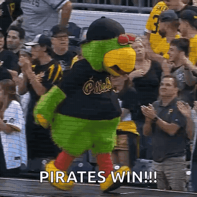 A Mascot For The Pirates Is Dancing In Front Of A Crowd At A Baseball Game GIF